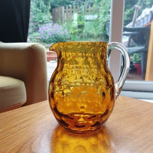 Mid-Century hand crafted, hand blown globular Amber and clear glass Jug. Vintage glassware polished pontil, applied handle. Vintage pitcher.