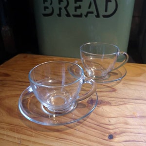 Pair of Vintage clear glass Arcoroc coffee cups and saucers. Vintage Glassware. Vintage French coffee cups.