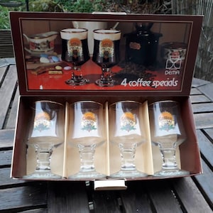 Set of 4 vintage 1970s Dema coffee specials stemmed glasses with gold rim in original box. Made in England.
