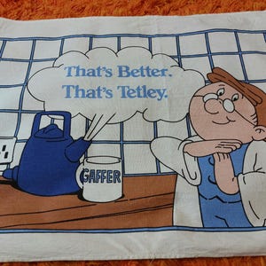 Paño de cocina vintage de los años 90 con publicidad de té Tetleys, paño de secado. Decoración de cocina vintage. Paño de cocina retro Tetleys Folk.