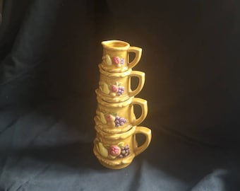 Set of 4 vintage 1960s Stackable Nesting ceramic measuring jugs. Vintage Kitsch Decor. Vintage Kitchen measuring pitchers.