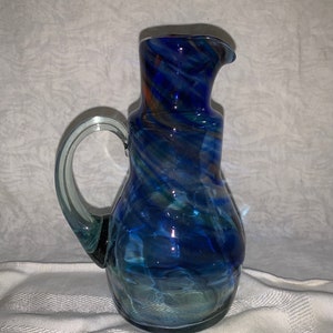 Handblown Pitcher Blue, Green, Red And Clear Swirls With Applied Handle.