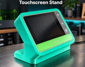 May include: A teal and lime green xTool F1 Ultra + F2 Ultra Touchscreen Stand with a black display screen. The device features a rectangular base, an angled screen housing, and the xTool logo printed on the lower front panel of the unit.
