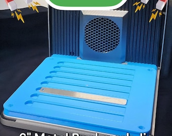 May include: A blue metal bookmark jig with a silver metal bookmark inside. The jig has a series of holes for creating bookmarks. The jig is labeled "F1 ULTRA" and "6" Metal Bookmark Jig".