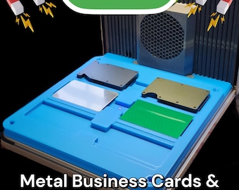 May include: A blue plastic jig with slots for metal business cards. The jig is labeled "F1 ULTRA" and has magnets on the sides. The jig is used to create minimalist wallets.