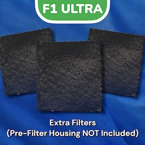 May include: Three black square-shaped air filters for a water filter system. The text "F1 ULTRA" is visible in green on a white background. The text "Extra Filters (Pre-Filter Housing NOT Included)" is also visible.