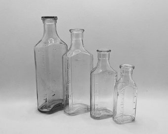 1910s-1930 Set of 4 Apothecary Medicine Bottles Pharmacy Embossed Measurements Vintage Drugstore