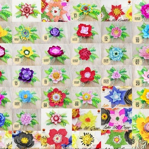 May include: A collection of 25 paper flowers in various colors, including pink, yellow, blue, red, and purple. The flowers are arranged in a grid pattern and are all made with crepe paper. Each flower has a number label.
