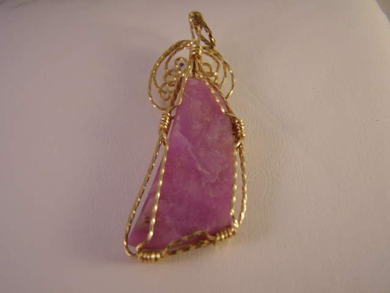 # GFP-001 Sugilite Cabochon Gold Filled Wrap Pendant 56mm Long 31.0cts