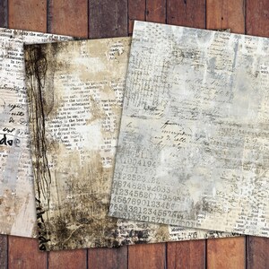 May include: Four sheets of vintage-style paper with aged textures and handwritten script. The papers feature a mix of beige, grey, and white tones, with visible text and numbers. A sprig of flowers is visible on one sheet. The papers are arranged on a wooden surface.