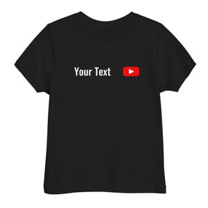 May include: Black t-shirt featuring the white text "Your Text" and a red and white play button logo. The t-shirt has a crew neck design.
