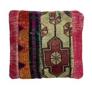 May include: A red, orange, green, and blue patterned throw pillow with a fringe border.