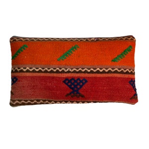 May include: A rectangular cushion with a woven pattern in shades of orange, red, brown, and green. The cushion has a geometric design with a central motif of a stylised cup.