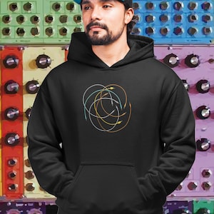 May include: Black hooded sweatshirt with a colorful abstract design of overlapping circles and lines.