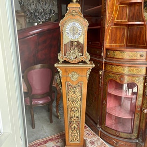 Clock with column Boulle style wooden bronze and brass