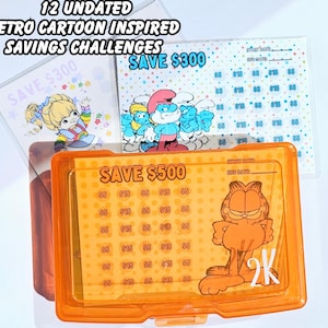 May include: Twelve orange plastic containers with a gridded chart inside. Each container has a cartoon character on the front. The characters are Smurfs, Garfield, and a girl with rainbow hair. The containers are labeled "Save $300" and "Save $500".