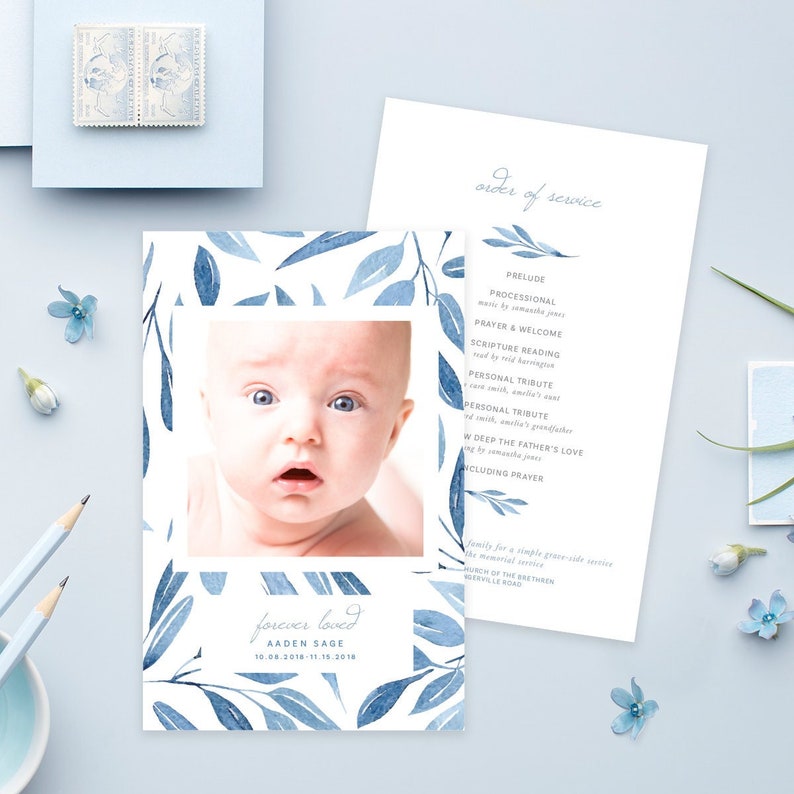 May include: A memorial card with a watercolor background of blue leaves and a photo of a baby boy. The text reads "forever loved Aaden Sage 10-08-2018-11-18-2018".