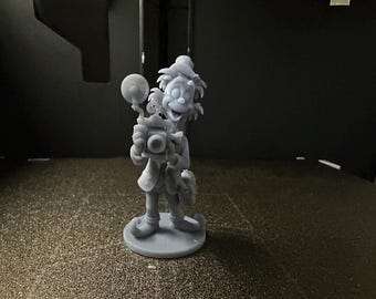 May include: A light gray 3D printed figurine of a character with wild hair, wearing a hat and shoes with curled toes, holding a vintage camera with a large circular flash attachment, standing on a circular base, captured in a monochromatic finish.