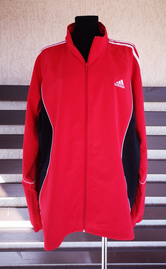 red adidas jacket with white stripes