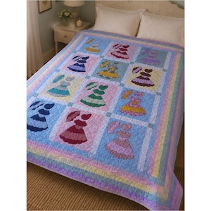 May include: A quilt featuring a grid of twelve squares, each displaying a different colored dress and matching parasol. The quilt has a light blue background with a multi-colored striped border in shades of yellow, pink, and blue.