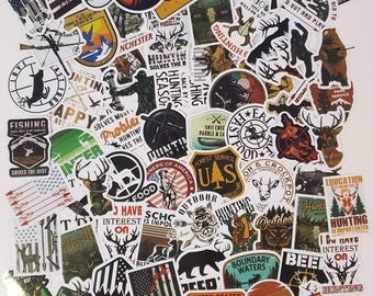 May include: A collection of colorful stickers featuring hunting and fishing themes. The stickers feature various designs, including animals, guns, and outdoor scenes. Some of the stickers have text, such as "Hunting", "Fishing", "Hunter", and "Outdoor".