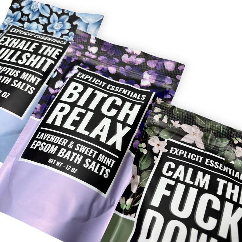 May include: Three pouches of Epsom bath salts with floral patterns and bold text. The pouches read "Exhale the Bullshit," "Bitch Relax," and "Calm the Fuck Down." Each pouch is 12 oz.