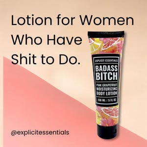 May include: A squeeze tube of pink grapefruit moisturizing body lotion with a black cap. The label reads Explicit Essentials Badass Bitch Pink Grapefruit Moisturizing Body Lotion 150 ml / 5 fl oz. The text Lotion for Women Who Have Shit to Do is visible.
