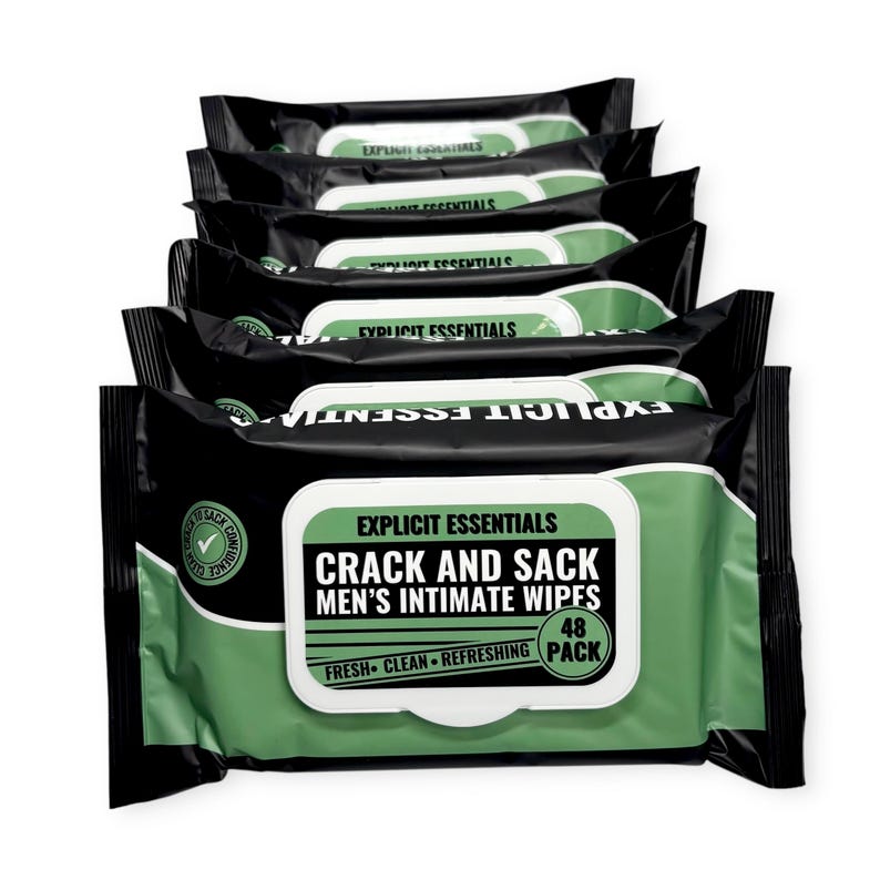 May include: A stack of black and green packages of Explicit Essentials Crack and Sack Men's Intimate Wipes. Each package has a white label with black text and a green border. The packages are labeled as a 48-pack.