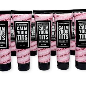 May include: Multiple tubes of bust and body wash are displayed. Each tube is black with a pink label. The label reads "CALM YOUR TITS" in large white letters. The product is from "Explicit Essentials" and is 150ml.