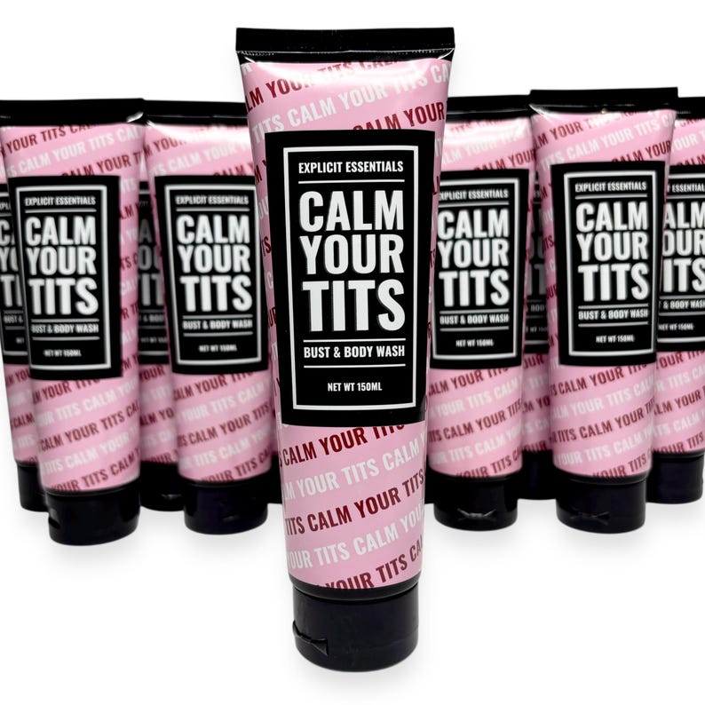 May include: Pink and black tubes of "Calm Your Tits" bust and body wash. The tubes have a black cap and a label with the product name in large white letters. The brand name "Explicit Essentials" is also on the label. The net weight is 150ml.
