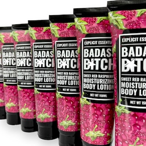 May include: Eight bottles of body lotion with a black and white label that says "Badass Bitch" in bold letters. The bottles are decorated with a raspberry design and the text "Sweet Red Raspberry Moisturizing Body Lotion" in black text. The bottles are 150 ml each.