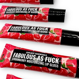 May include: Three tubes of strawberry flavored lip gloss with a red and white strawberry design. The tubes are labeled "EXPLICIT ESSENTIALS FABULOUS AS FUCK STRAWBERRY MOISTURIZING LIP GLOSS".