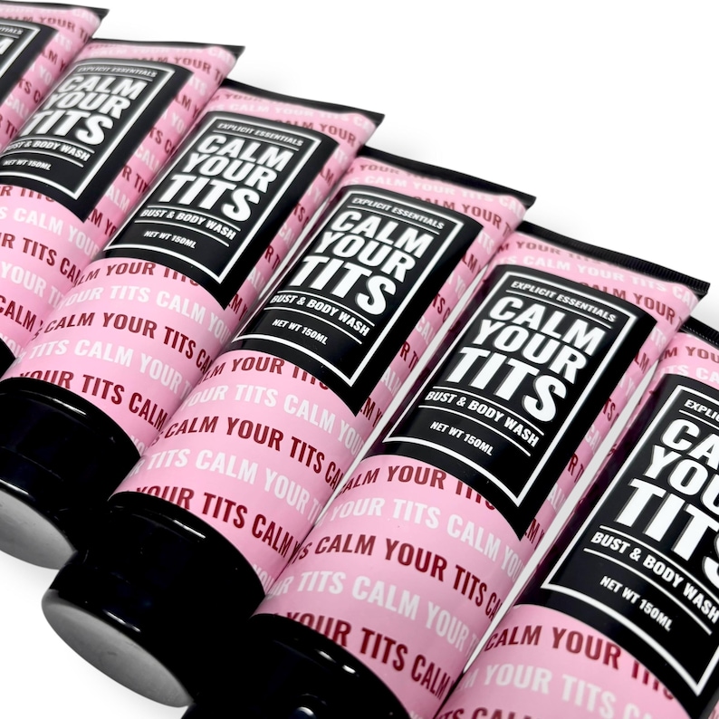 May include: Several pink tubes of "CALM YOUR TITS" bust and body wash are arranged in a row. Each tube has a black cap and a label with the product name in bold white letters on a black background. The net weight is 150ml.
