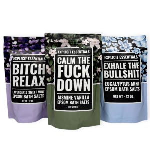 May include: Three bags of Epsom bath salts with bold text. The bags are lavender, green, and blue, each with a floral pattern. The text on the bags reads "Bitch Relax", "Calm the Fuck Down", and "Exhale the Bullshit". Each bag contains 12 oz of bath salts.
