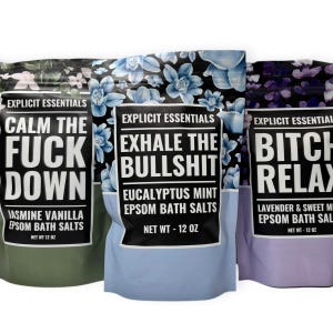 May include: Three bags of Epsom bath salts with floral patterns and bold text. The bags are green, blue, and purple, with phrases like "Calm the F*ck Down," "Exhale the Bullsh*t," and "B*tch Relax." Each bag contains 12 oz of bath salts.