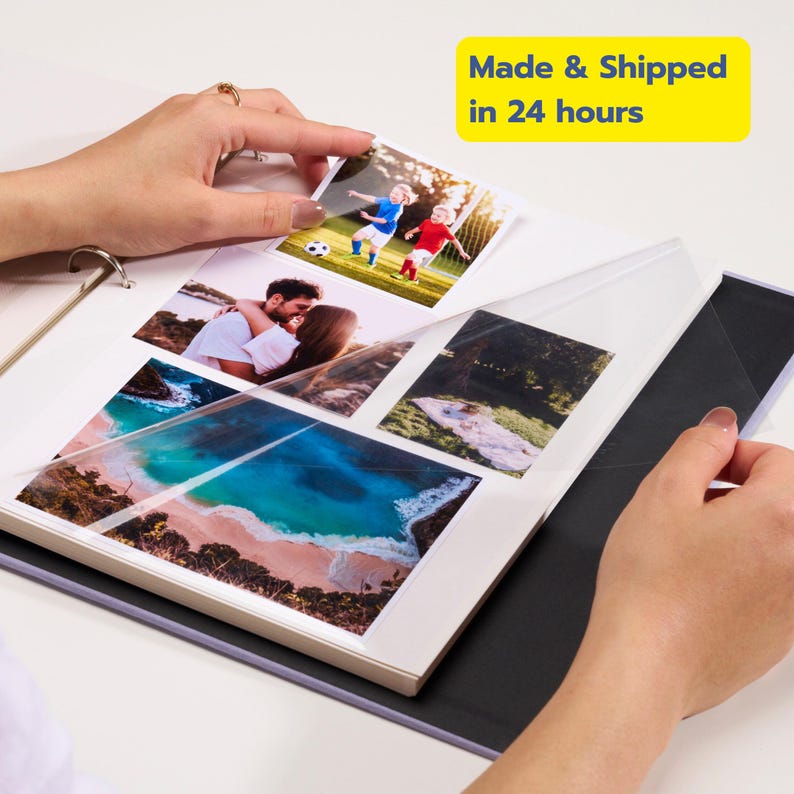 May include: A photo album with clear plastic sleeves containing various printed photographs, including images of children playing soccer, a couple embracing, a coastal landscape, and a picnic scene, with a metal ring binder mechanism.