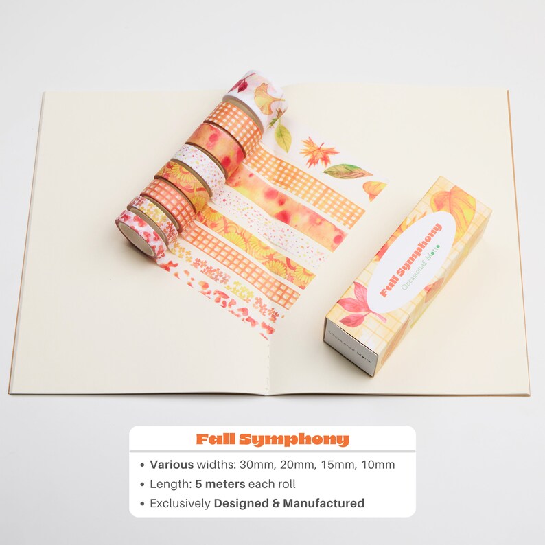 May include: A set of eight washi tapes with autumn-themed designs, including leaves, gingham patterns, and watercolour washes. The tapes are rolled up and arranged in a circle. The tapes are packaged in a box with the text "Fall Symphony" and "Occasional Mem".