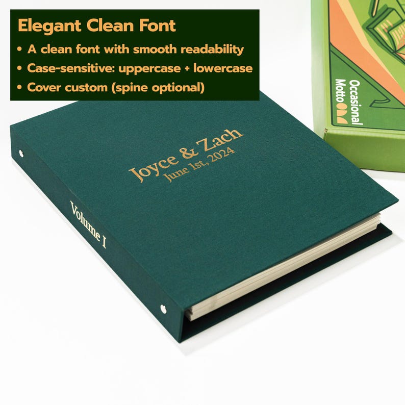 May include: A dark green binder with gold foil text on the cover reading Joyce & Zach June 1st, 2024 and the text Volume I on the spine. The binder features a clean font, metal ring mechanisms, and off-white pages visible along the side edge.