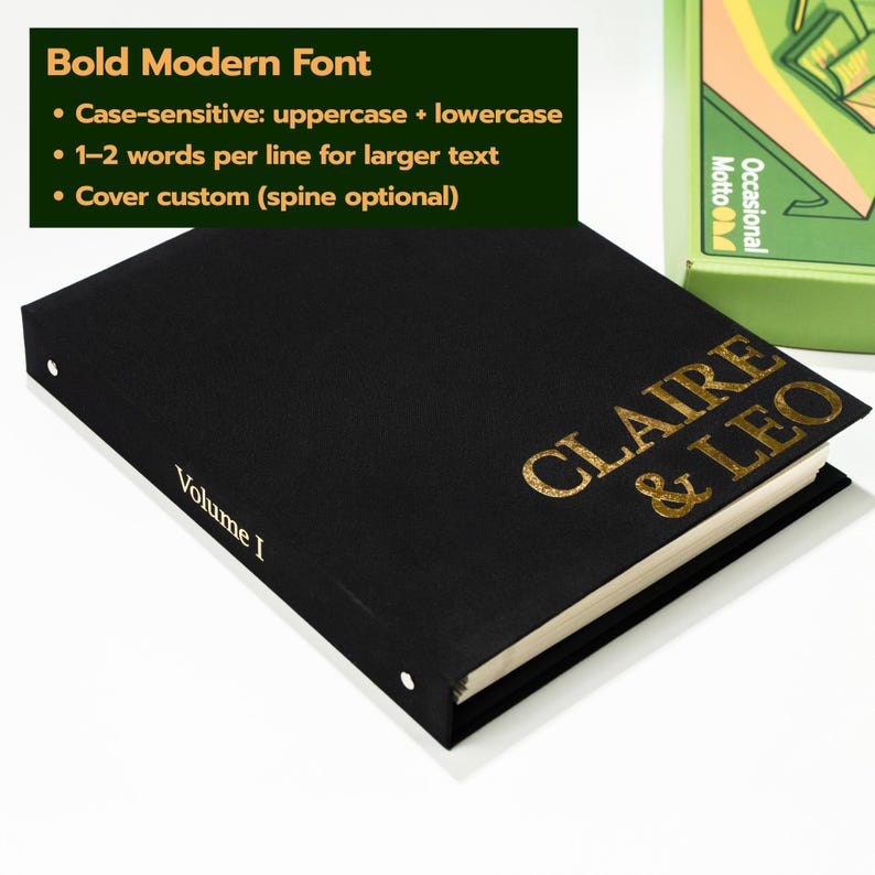 May include: A black hardcover book with gold foil lettering on the front cover reading CLAIRE & LEO and the text Volume I printed on the spine. The book features a textured finish and is positioned next to a green box with graphic illustrations.