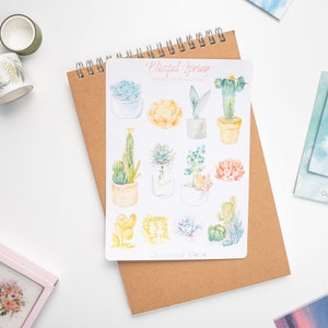 May include: A sheet of stickers featuring watercolor illustrations of succulents and cacti in various colors and styles. The stickers are titled "Blissful Spring Watercolor Succulents" and "Occasional Note".