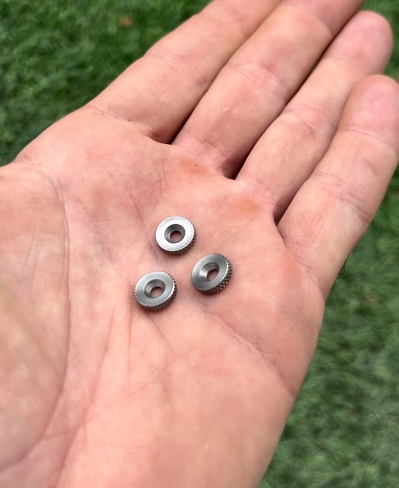 May include: Three silver metal rings with a textured surface.