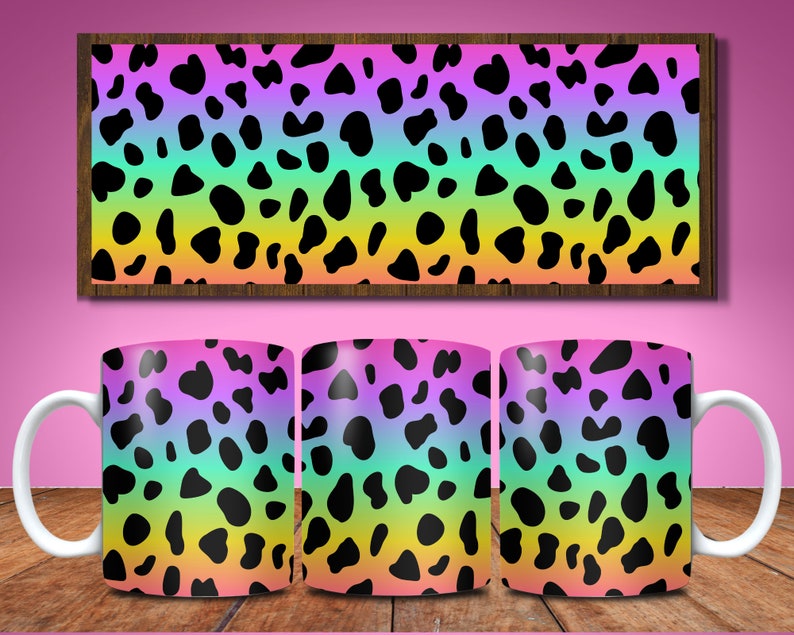 May include: Three white ceramic mugs with a rainbow gradient and black cow print design.