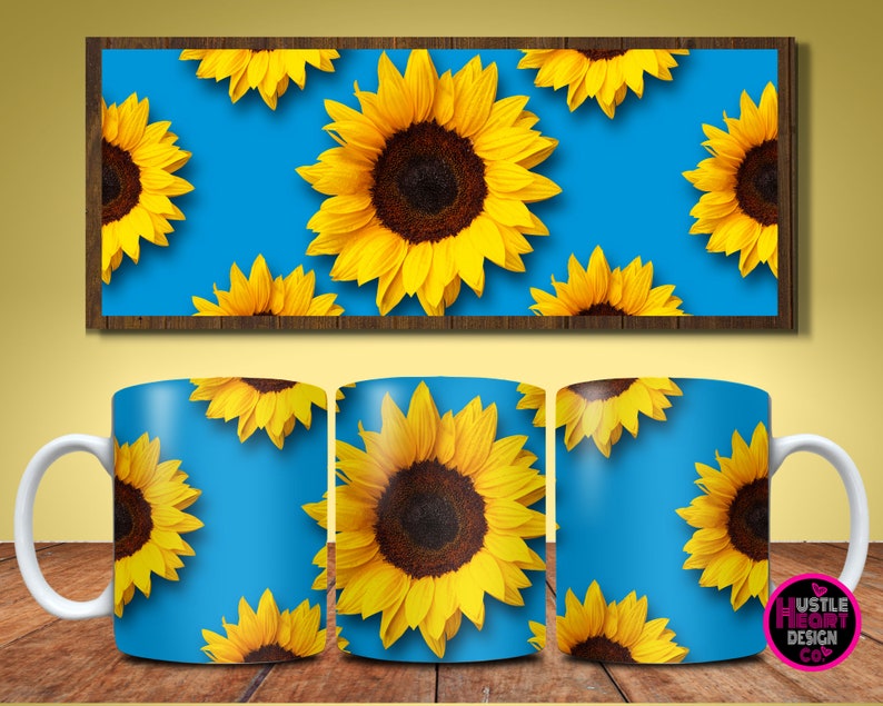 May include: White ceramic mug with a blue background and a repeating pattern of yellow sunflowers. The mug has a handle on the left side.