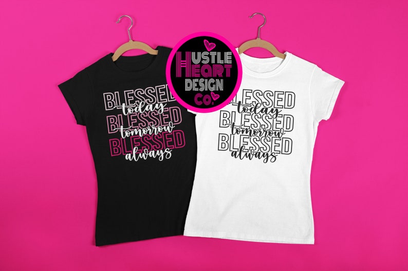 May include: Two t-shirts with the text "Blessed today, Blessed tomorrow, Blessed always" in a stacked, layered design. The shirts are black and white and are hanging on hangers against a pink background. The Hustle Heart Design Co. logo is visible in the top center of the image.