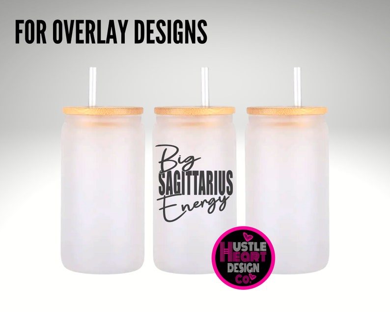 May include: Three frosted glass tumblers with bamboo lids and straws. The middle tumbler has the text "Big Sagittarius Energy" in black lettering. The tumblers are on a gray background.