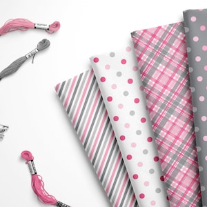May include: Four fabric swatches with different patterns: pink and gray plaid, pink and white polka dots, gray and white stripes, and gray with pink polka dots. Two spools of pink embroidery floss and one spool of gray embroidery floss are also shown.