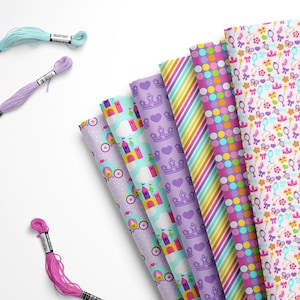 May include: A set of eight different patterned fabric squares featuring princess-themed designs. The fabrics include a pink and purple polka dot pattern, a rainbow stripe pattern, a purple and white crown pattern, a blue and white castle pattern, a purple and white carriage pattern, and a white fabric with pink, purple, and yellow princess-themed icons.