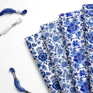 May include: A set of five blue and white floral fabric panels with a repeating pattern. The fabric is perfect for quilting, crafting, and home decor projects.