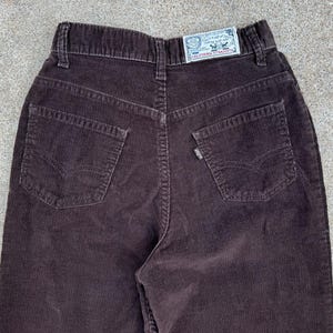 May include: Brown corduroy trousers with a back pocket and a Levi's label that says "California Straight".
