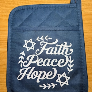 May include: A blue quilted pot holder with a white design that says "Faith Peace Hope" with a Star of David on either side.